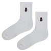 Cat Patch White Socks. Designed with a clean white base and a subtle embroidered black cat wearing sunglasses,