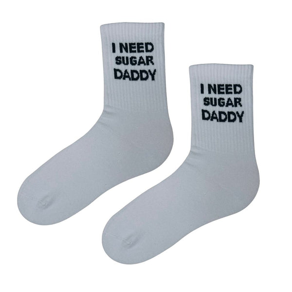I Need Sugar Daddy Socks are the ultimate conversation starters. With bold black text on crisp white cotton, they’re perfect for those who love humor, irony, or making a statement