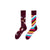 Magical Unicorn & Rainbow Striped Socks. One sock features playful unicorns, rainbows, and stars on a deep maroon background