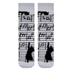 Musical Cat Socks. Designed in black and white with playful music notes and cat silhouettes climbing the staff, these socks are the perfect mix of fun and stylish.