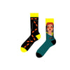 Street Vibes Socks – Chains & Shades Edition. One sock features an edgy black-and-yellow pattern with orange links and chain graphics, while the other rocks a bold illustration of a street-style girl in braids, sunglasses, and a red cap