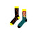 Street Vibes Socks – Chains & Shades Edition. One sock features an edgy black-and-yellow pattern with orange links and chain graphics, while the other rocks a bold illustration of a street-style girl in braids, sunglasses, and a red cap