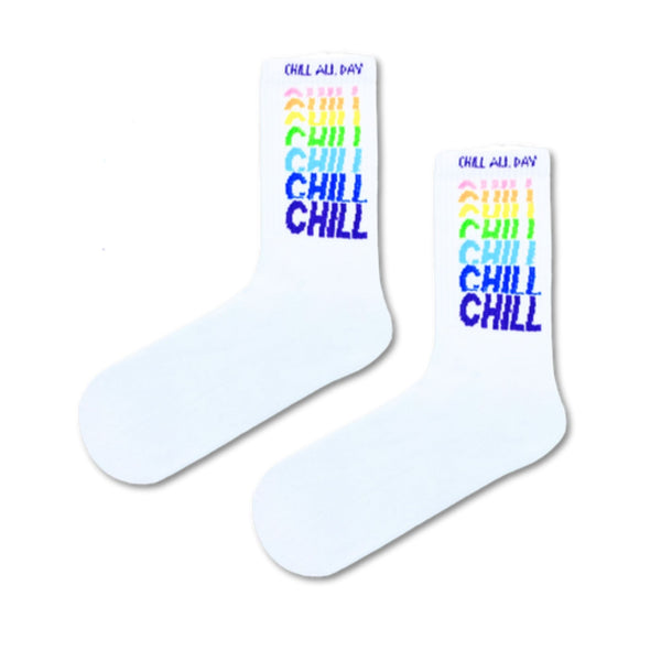 Chill All Day Socks – Rainbow Edition. These playful white crew socks feature a colorful vertical “CHILL” print that adds a fun twist to your daily outfit.