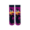 Daffy Duck Looney Tunes Socks. Featuring the iconic cartoon duck in his signature pose on a vivid purple backdrop, these socks bring animated attitude to your everyday look.