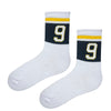 White athletic socks with green and yellow stripes featuring number 9 design