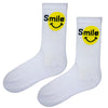 Stay Smiling Socks – White & Yellow Edition. Featuring a bright yellow smiley face and cheerful “Smile” text, these socks are perfect for spreading good vibes.