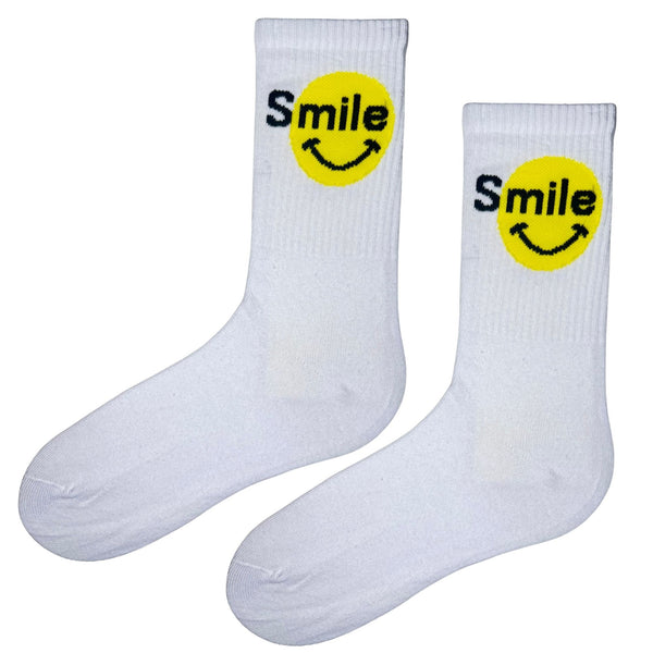 Stay Smiling Socks – White & Yellow Edition. Featuring a bright yellow smiley face and cheerful “Smile” text, these socks are perfect for spreading good vibes.