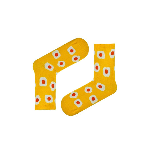 sunny side up with these bright yellow egg-themed socks! Featuring a playful fried egg pattern on a cheerful yellow base