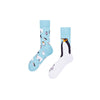  Penguin Party mismatched crew socks. One sock features a majestic emperor penguin design, while the other is packed with cute polar animals like baby penguins, polar bears, and snow bunnies. 